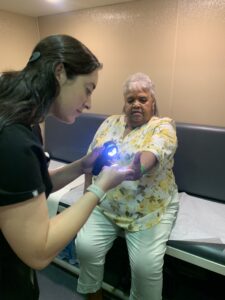 An Engaging the Generations participant receives a skin cancer screening